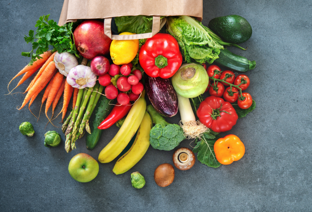 mixed vegetables in paper grocery bag